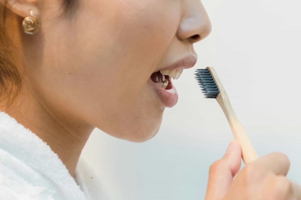 woman brushing teeth